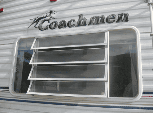 Close up photo of a Coachmen RV bathroom window.