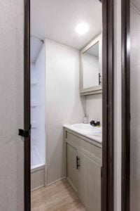 2027 Forest River Cherokee Alpha Wolf 28RLX Rear Living Room Couples Travel Trailer Interior Image