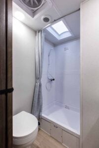 2027 Forest River Cherokee Alpha Wolf 28RLX Rear Living Room Couples Travel Trailer Interior Image