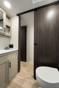 2027 Forest River Cherokee Alpha Wolf 28RLX Rear Living Room Couples Travel Trailer Interior Image